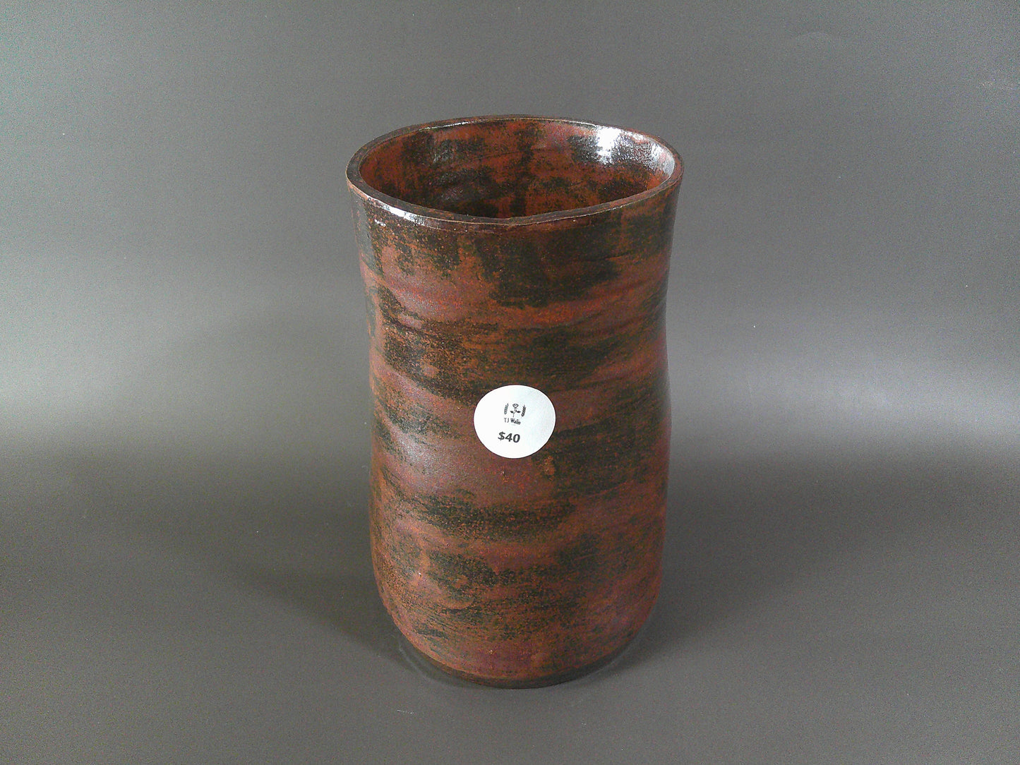 Tall Burgundy Pottery Vase $40